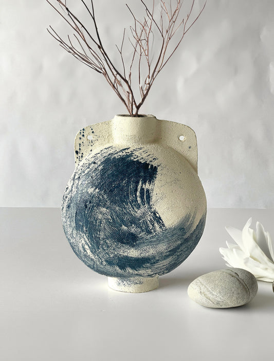 contemporary white natural clay vase with an exclusive and unique blue touch.